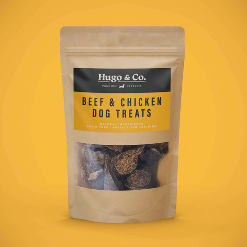 Package of beef and chicken dog treats from Hugo & Co. on a yellow background