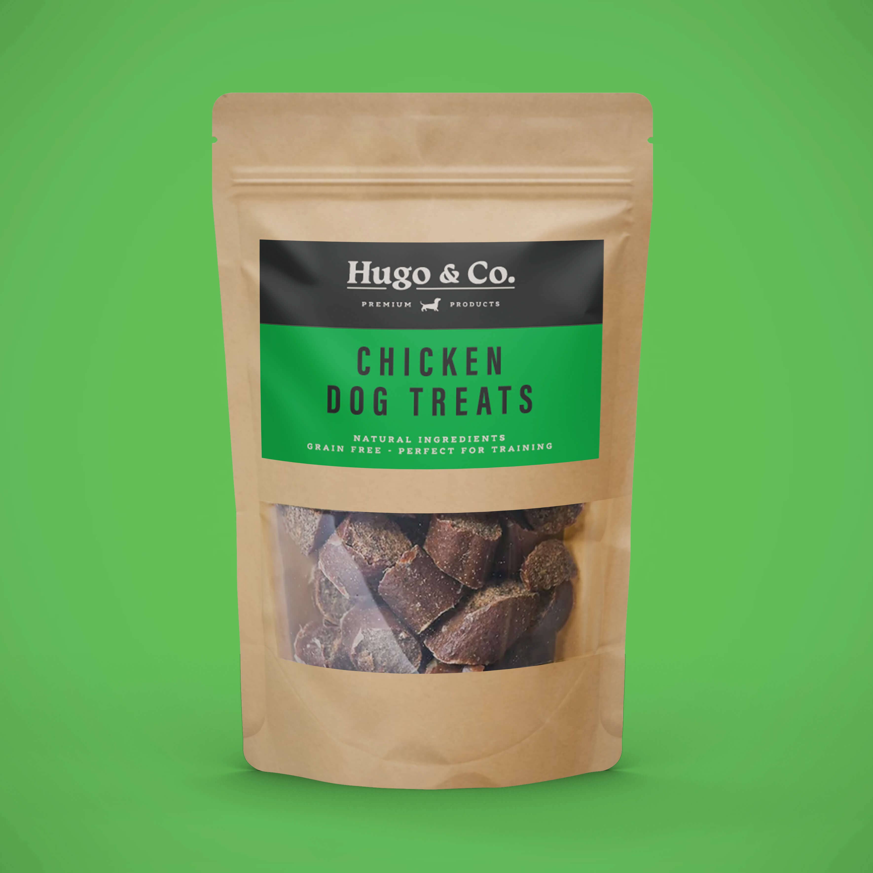 Package of Hugo & Co. chicken dog treats on a green background