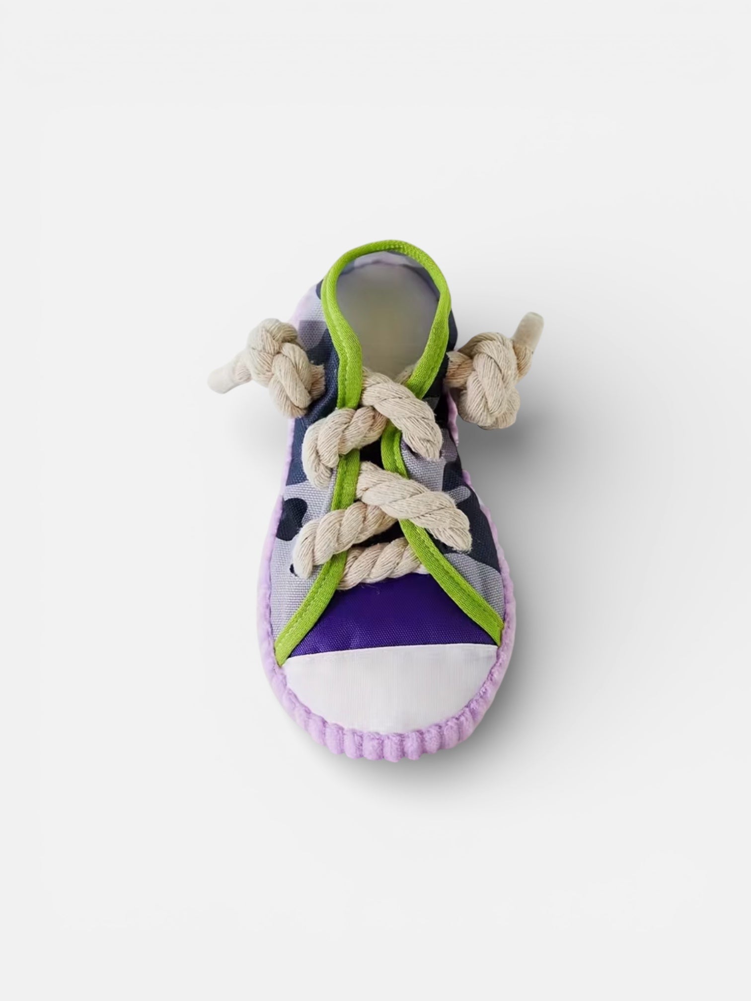 Purple sandal with green accents and rope details on a white background