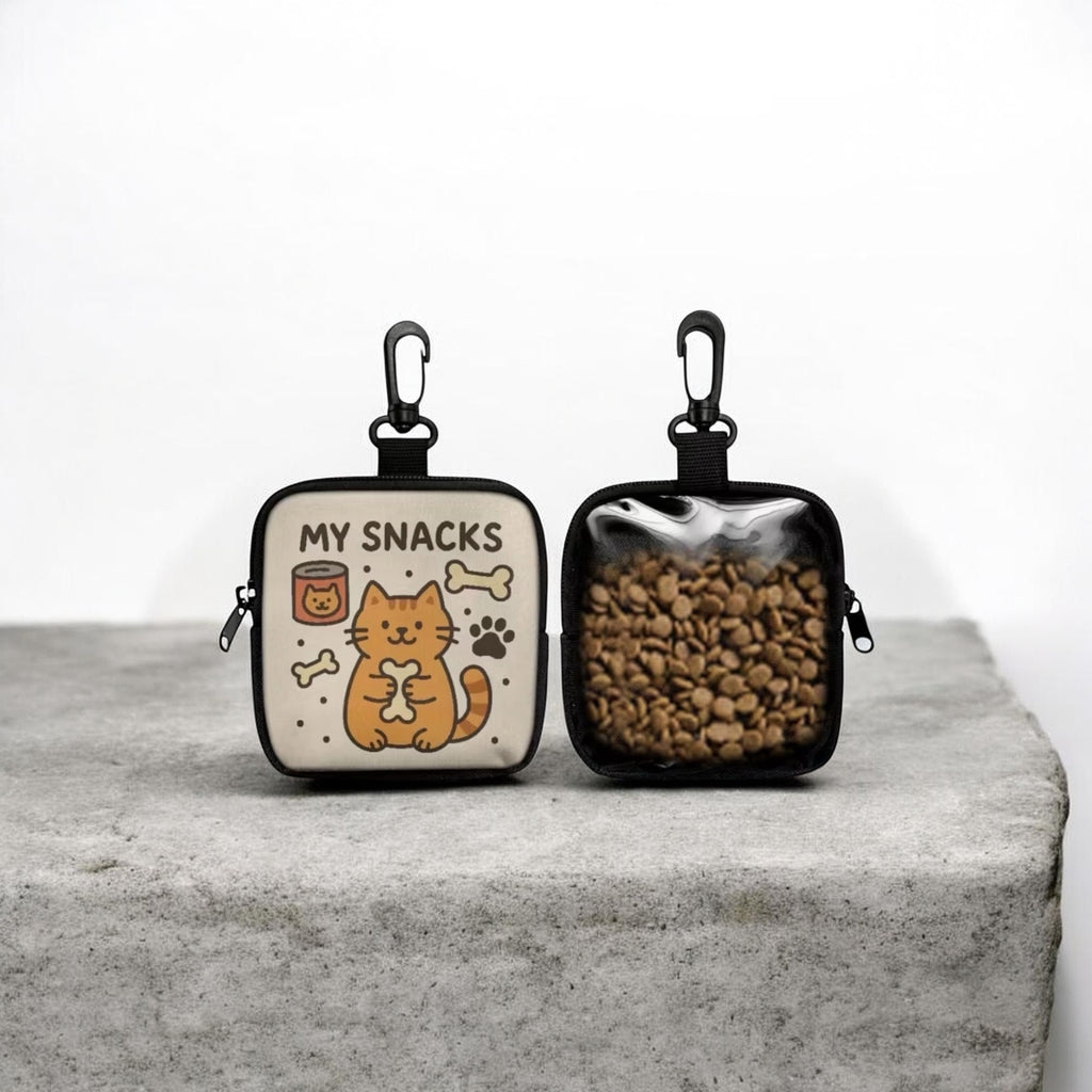 Two small pouches with cat illustrations on a gray surface
