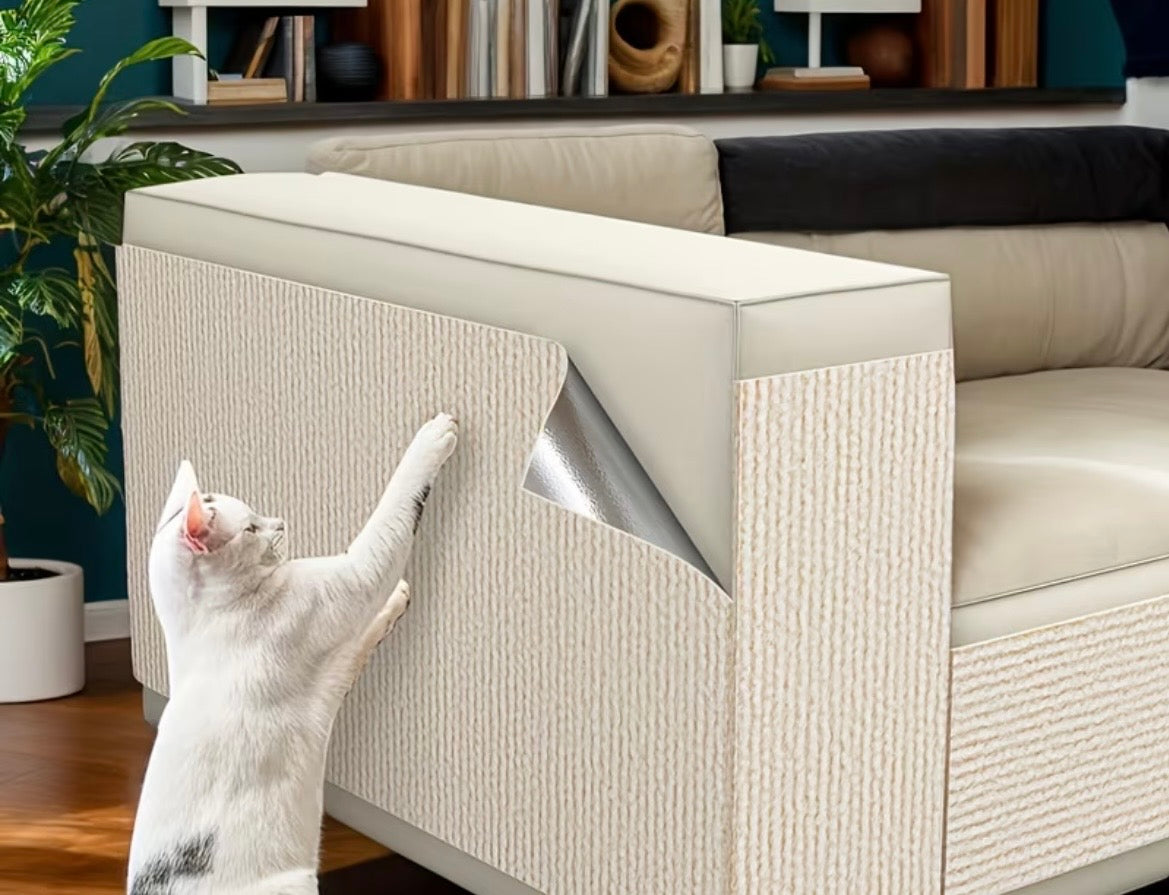Cat using a furniture protector on a sofa