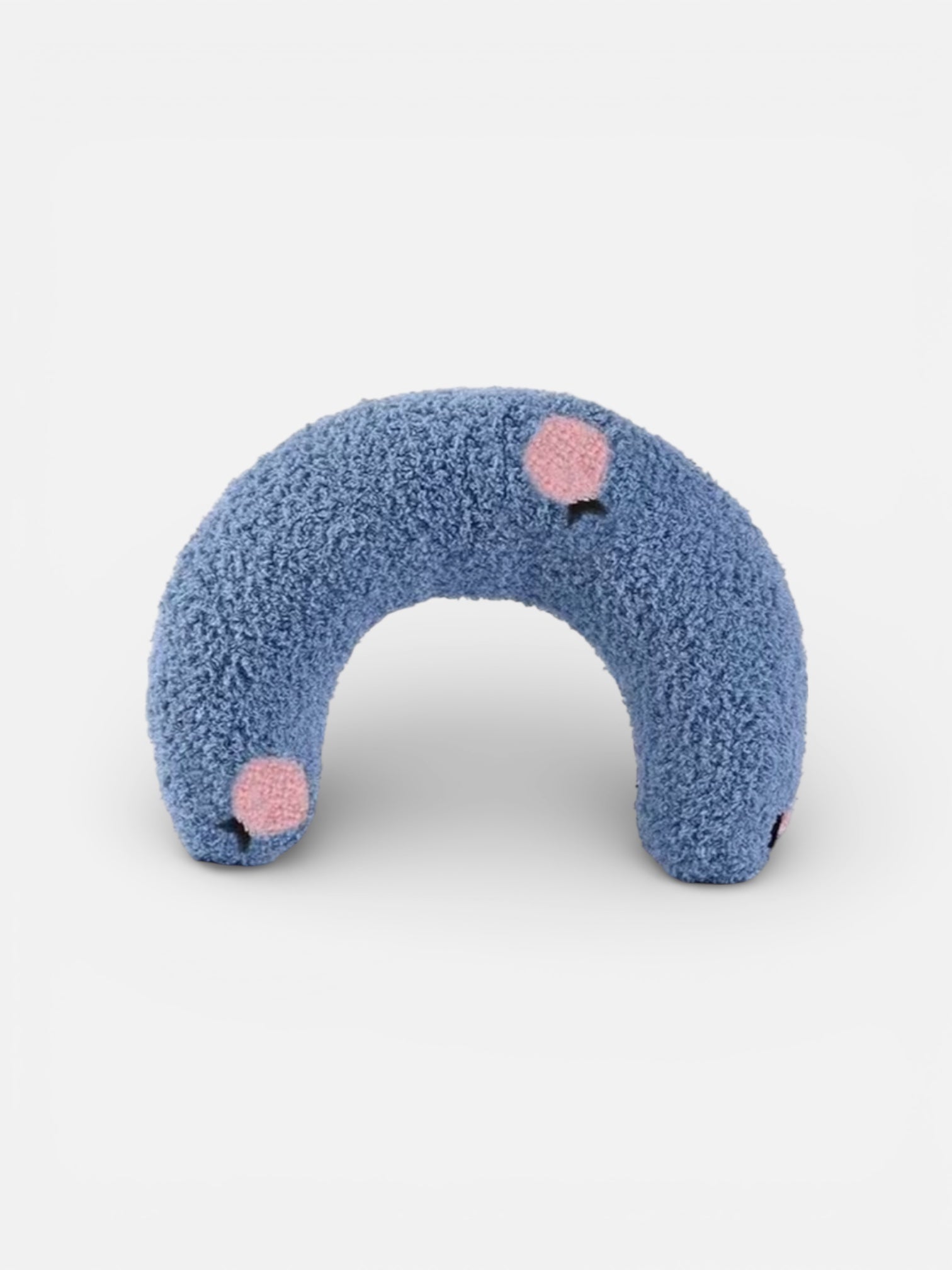 Blue fuzzy neck pillow with pink cheeks on a white background