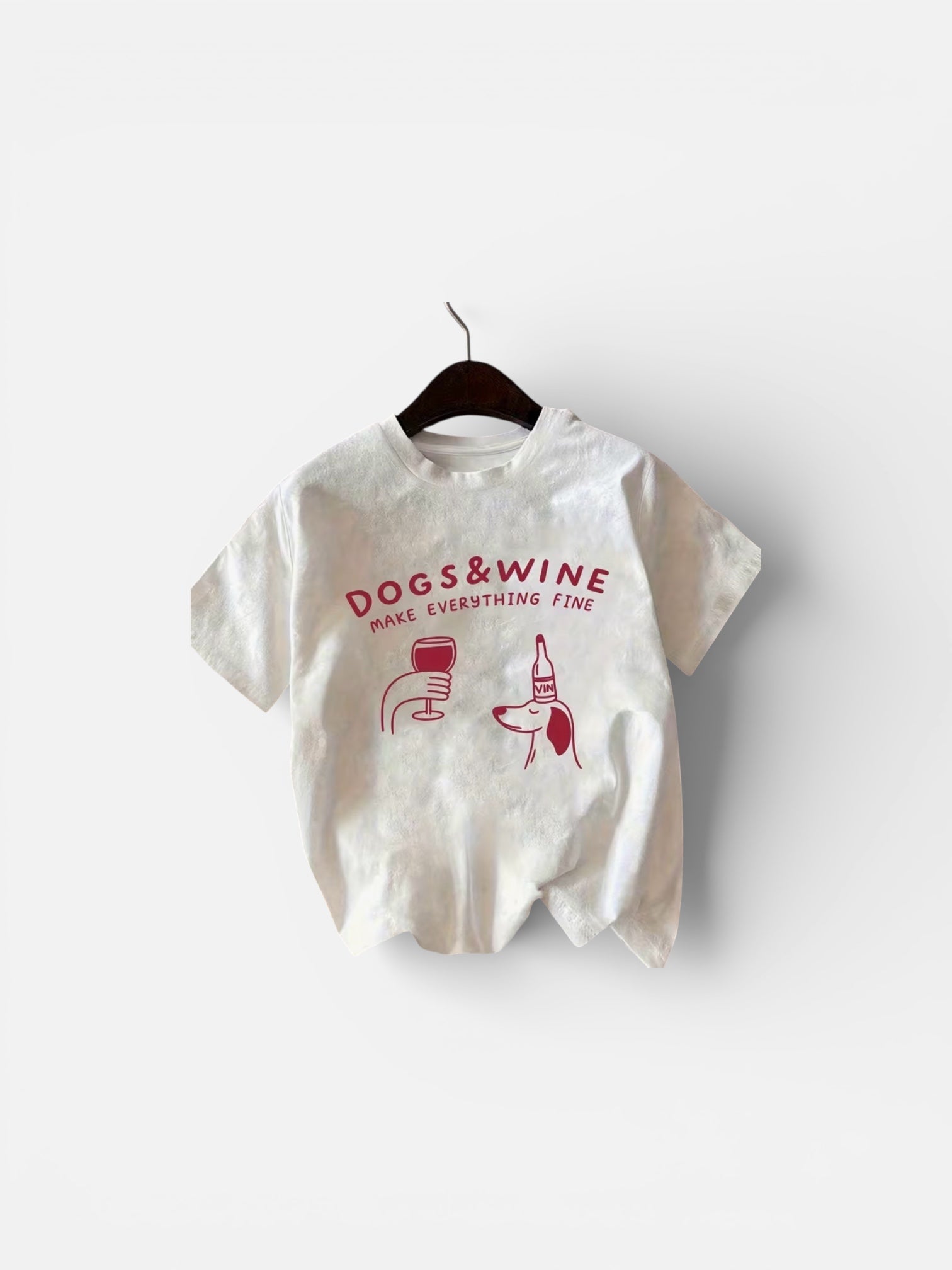 White t-shirt with 'Dogs & Wine' text and graphics on a white background