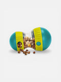 Teal and yellow pet toy with food inside on a white background