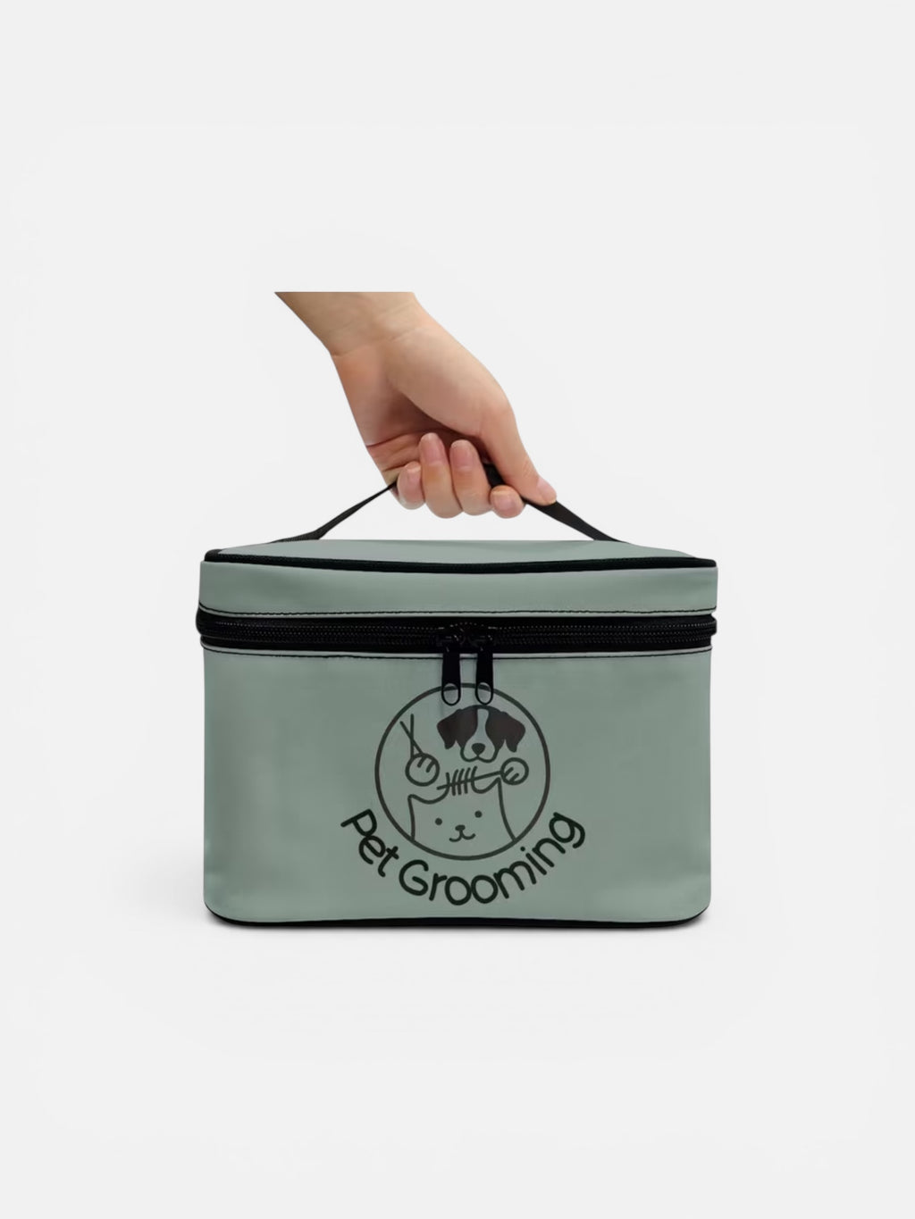 Hand holding a green pet grooming bag with a logo on a white background